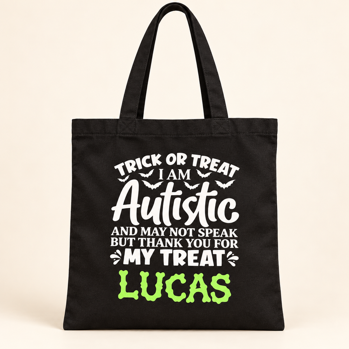 Black personalised autism awareness Halloween treat bag with white lettering and green glow in the dark name Lucas